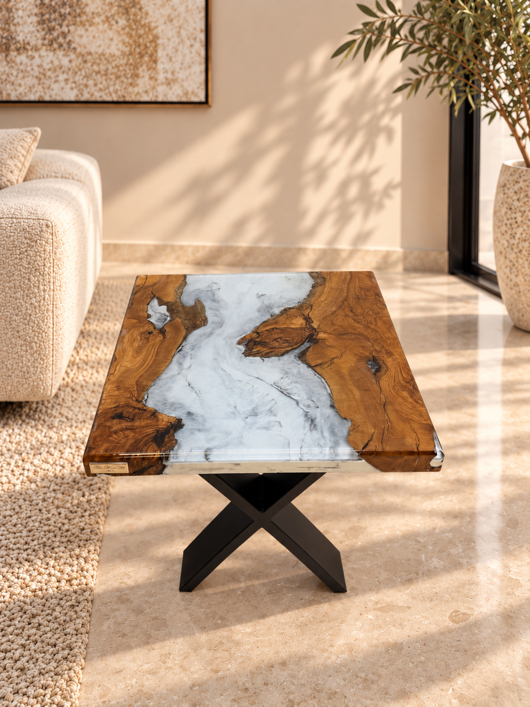 Top view of the olive wood side table highlighting the intricate grain and resin design.