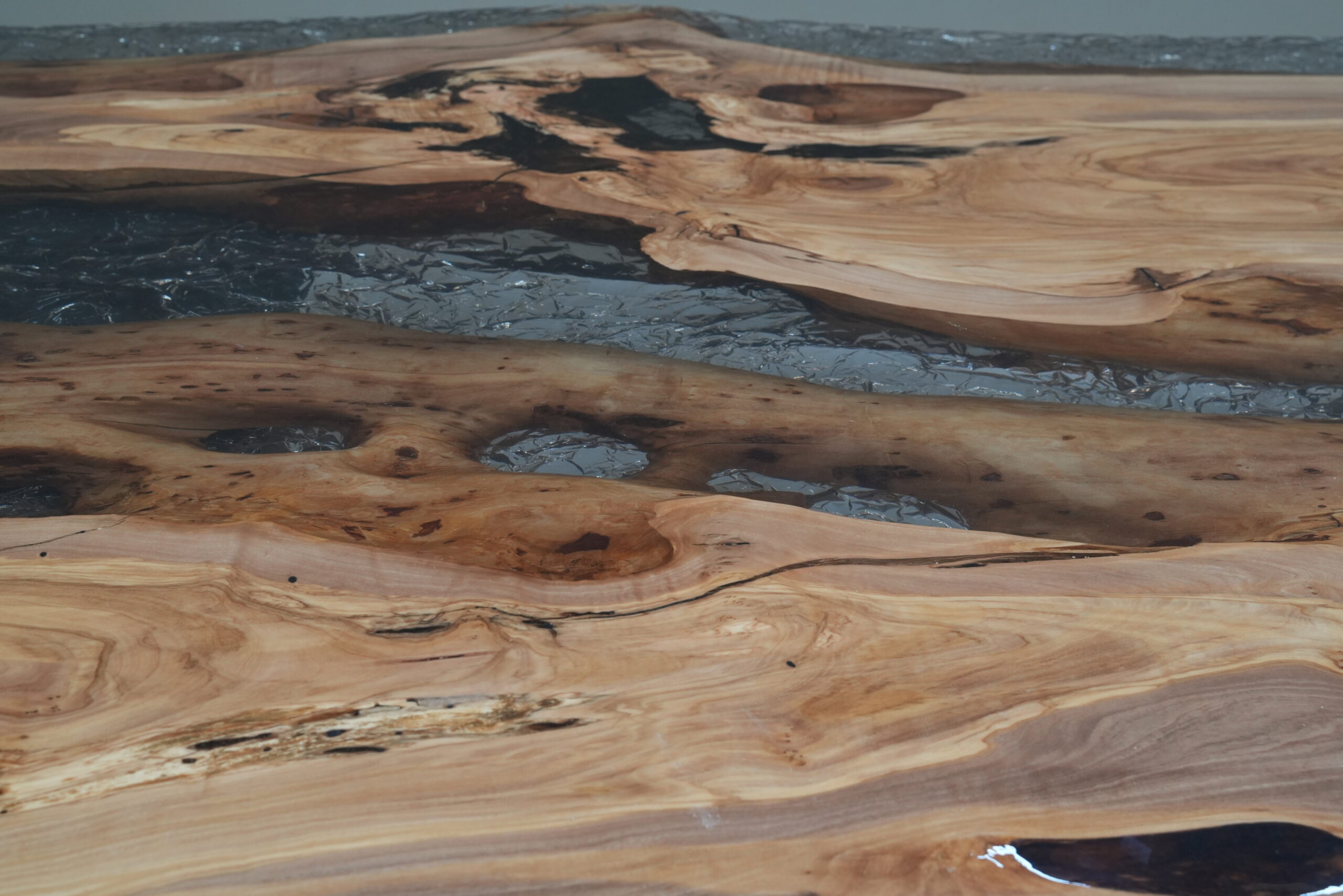 Image of the top surface illustrating the balance of wood tones and epoxy.