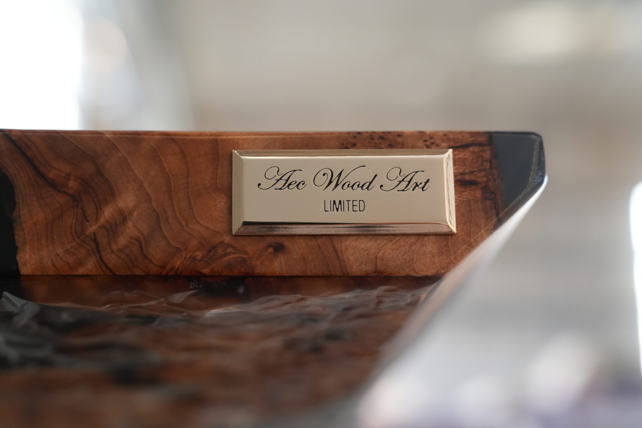 A side view of the Midnight Ice Console highlighting the sculptural base.