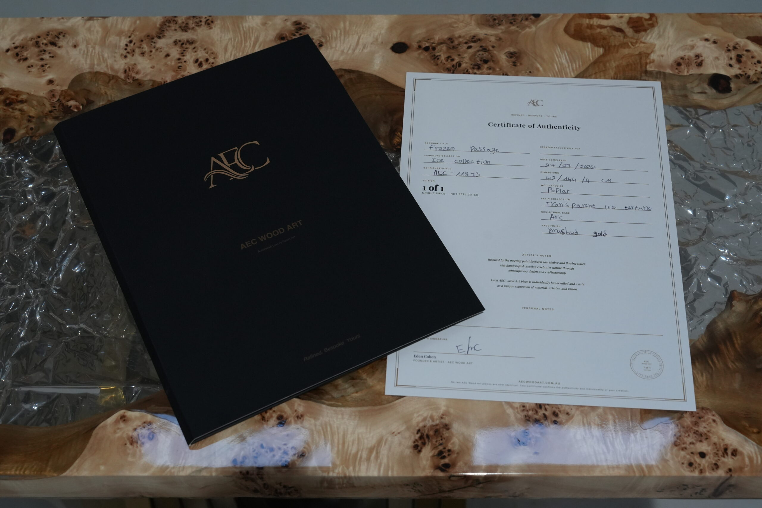 Close view of the Frozen Passage Console Table's certificate of authenticity and details.