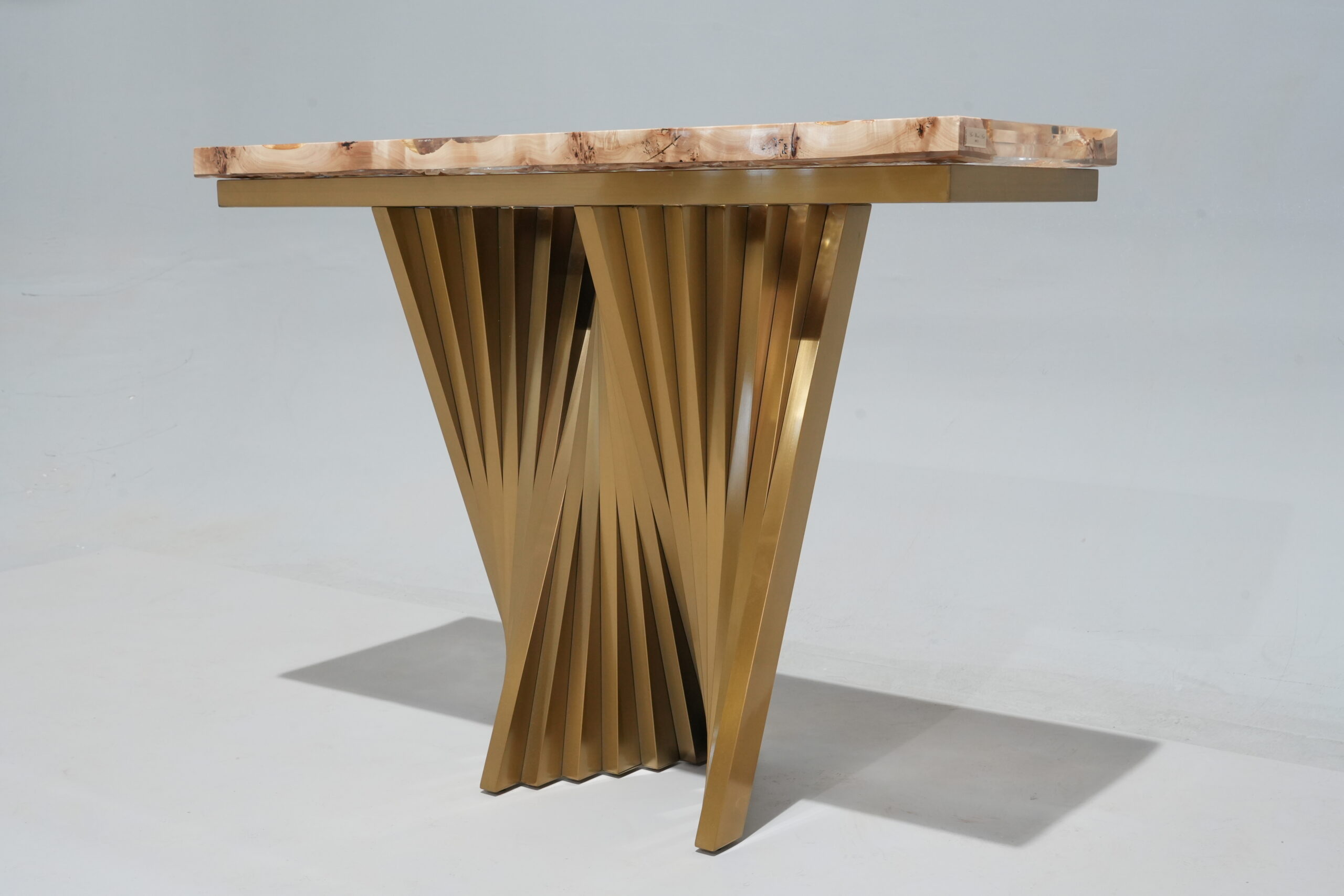 Side view of the Frozen Passage Console Table exhibiting the 'Arc' base.