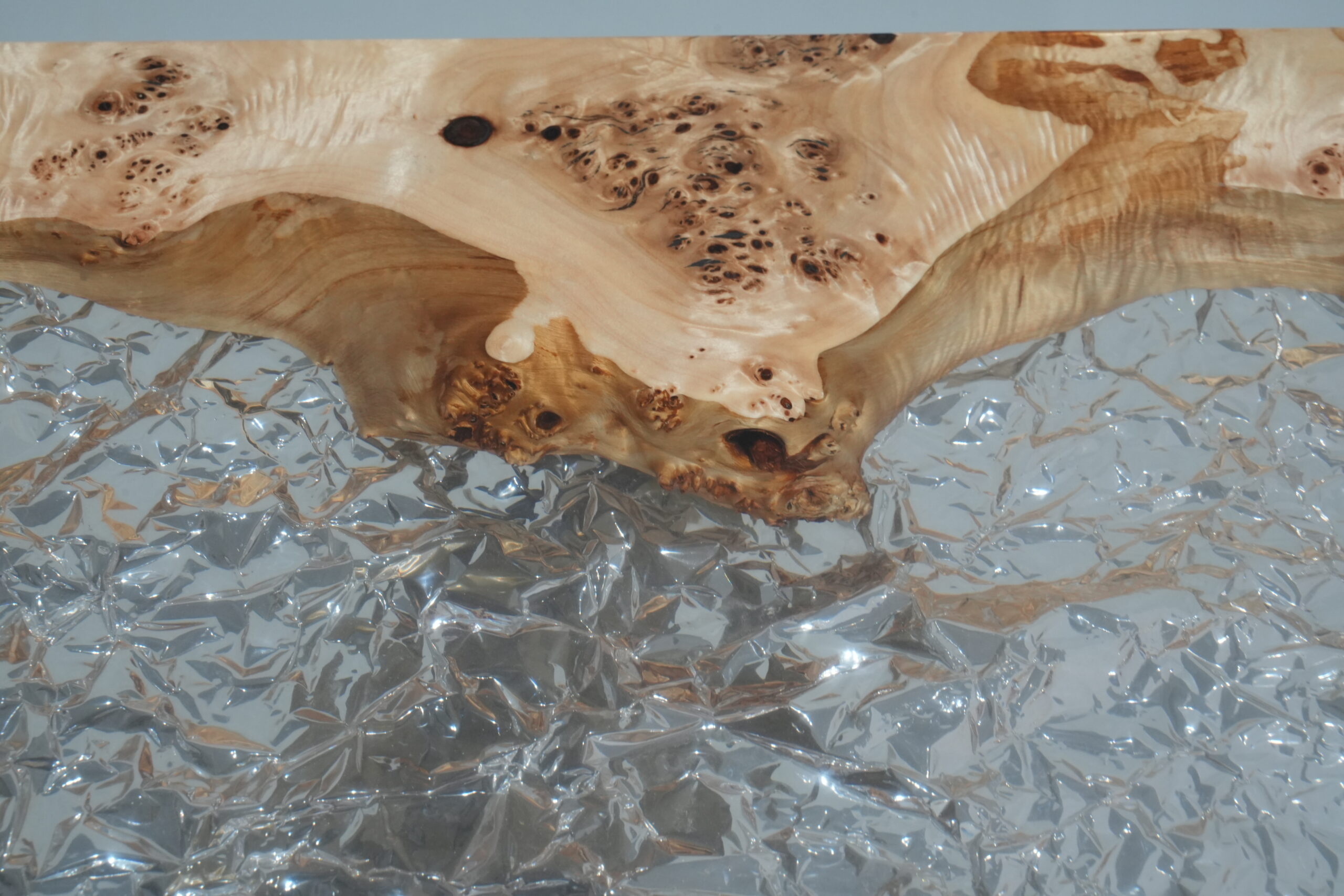 Close-up view of the poplar wood and clear epoxy detailing on the top.