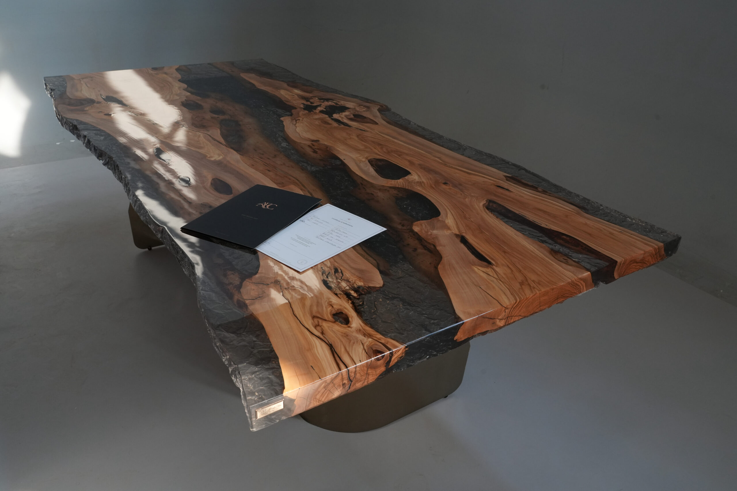 Another perspective of the table showing olive wood grain details.