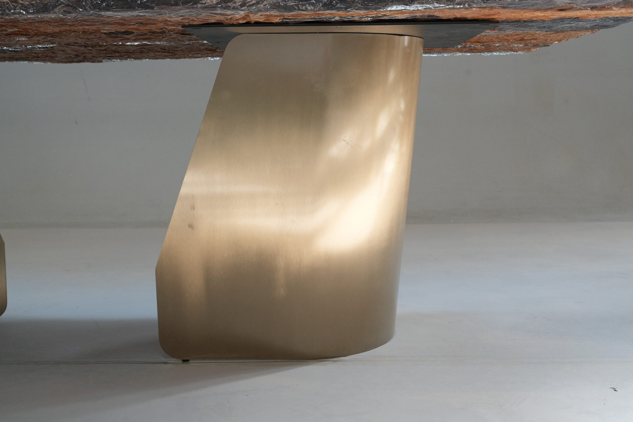Close-up of the table's surface, focusing on wood grain and epoxy edge.