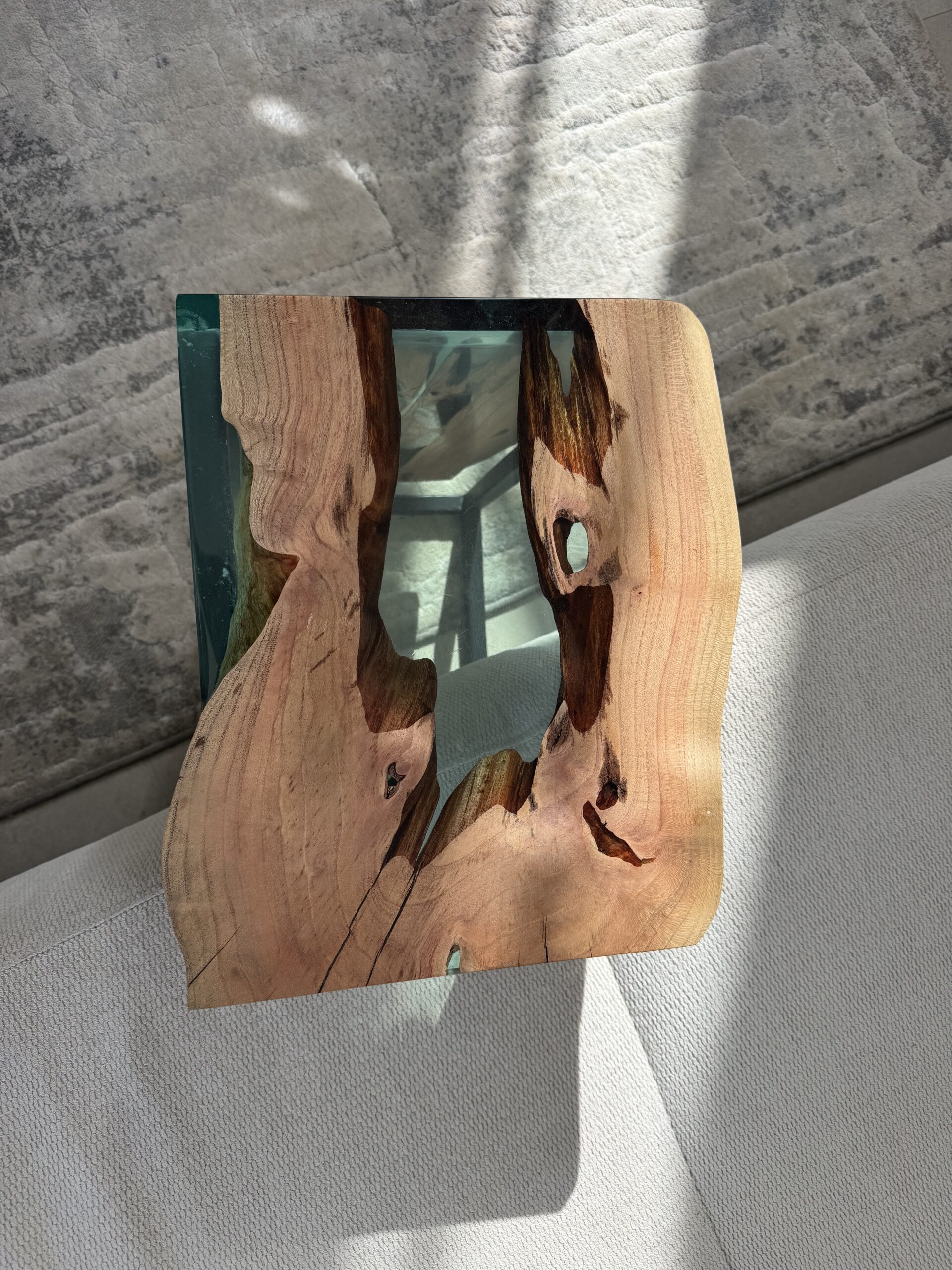 Top view of the carob wood side table, highlighting the epoxy centre and wood edges.